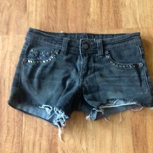 Five small black shorts